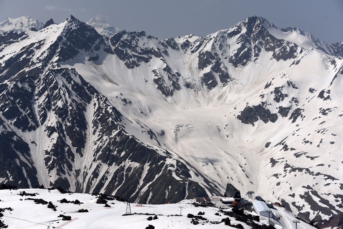 06B Looking Back At Mir Cable Car Station 3500m With Mount Cheget Above From Garabashi 3730m To Start The Mount Elbrus Climb